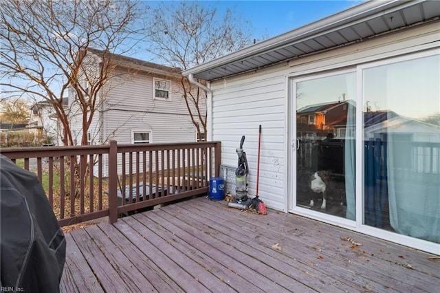 wooden deck with a grill