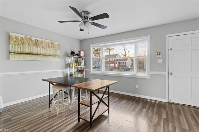 dining room featuring ceiling fan and dark hardwood / wood-style floors