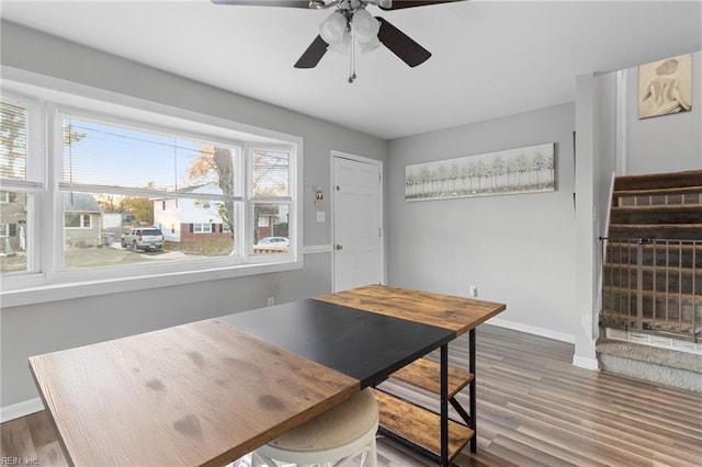 dining space with hardwood / wood-style floors, plenty of natural light, and ceiling fan