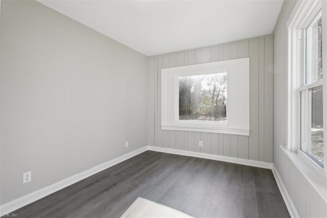 spare room featuring dark hardwood / wood-style floors