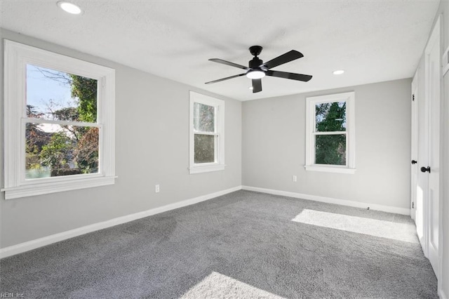 carpeted empty room with ceiling fan