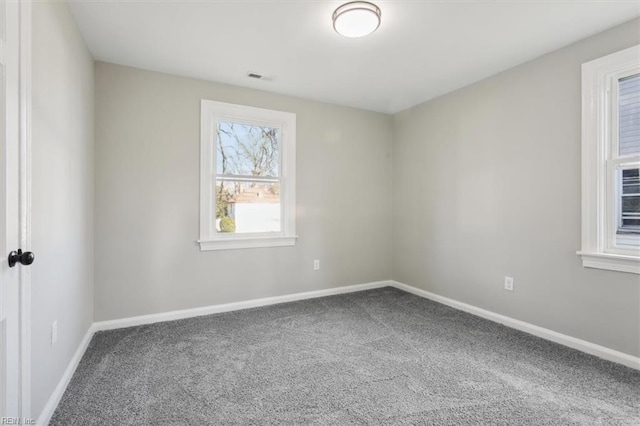 unfurnished room with carpet flooring