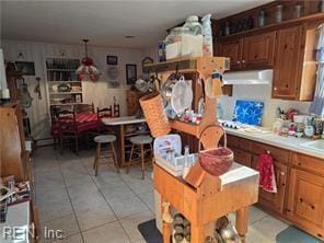 kitchen featuring light tile patterned floors and gas stovetop