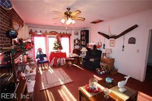 interior space with ceiling fan