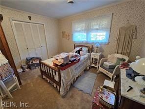 bedroom with carpet flooring, a closet, and ornamental molding