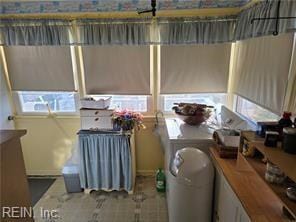 interior space featuring radiator heating unit and a healthy amount of sunlight