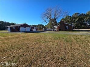 view of yard featuring a garage