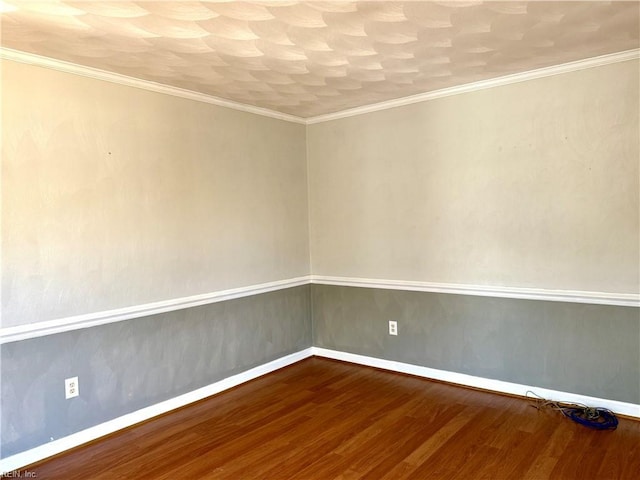 unfurnished room featuring hardwood / wood-style floors and ornamental molding