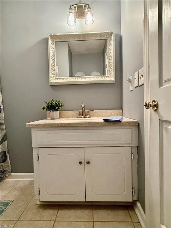 bathroom with tile patterned floors and vanity