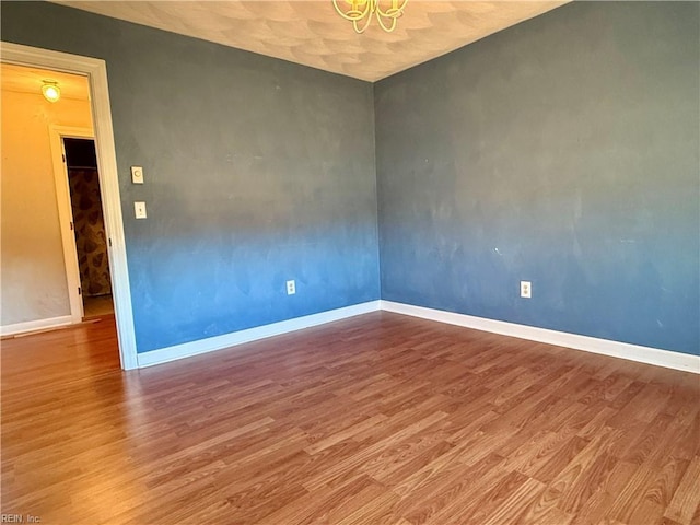 unfurnished room featuring hardwood / wood-style floors