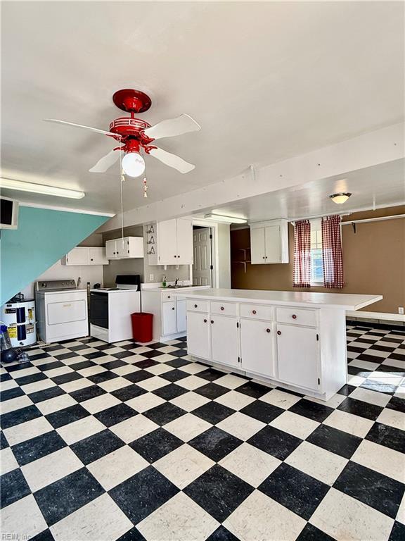 kitchen featuring washer / clothes dryer, ceiling fan, white cabinets, and white appliances