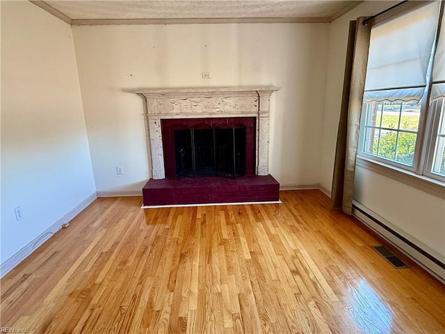 details featuring crown molding, hardwood / wood-style floors, and a baseboard radiator