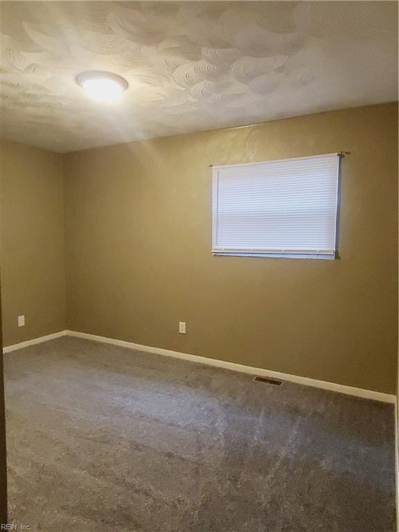 unfurnished room featuring carpet floors