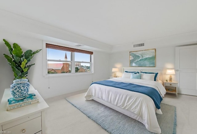 bedroom featuring light colored carpet