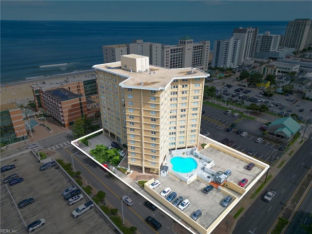 drone / aerial view with a view of the beach and a water view