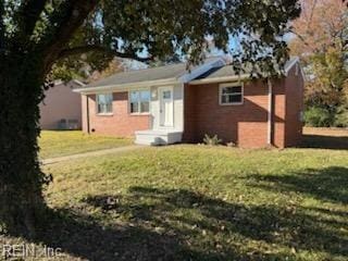 view of front of home with a front yard