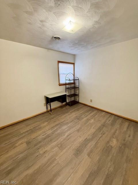 interior space with hardwood / wood-style floors