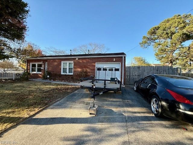 single story home with a garage