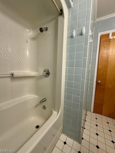 bathroom with  shower combination and tile patterned floors