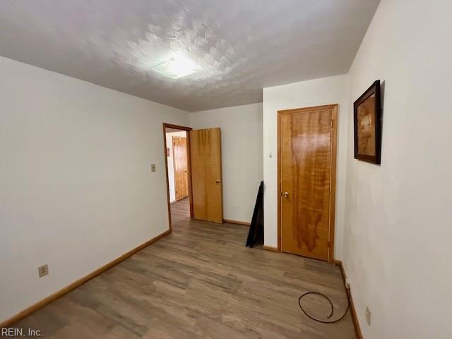 unfurnished room featuring light wood-type flooring