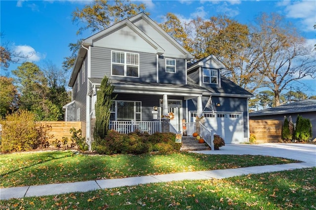 view of front of property featuring a front lawn, a porch, and a garage