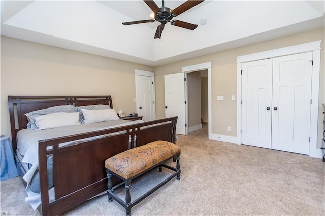 carpeted bedroom with ceiling fan and lofted ceiling