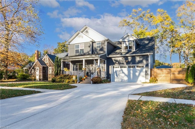 front of property with a porch and a garage