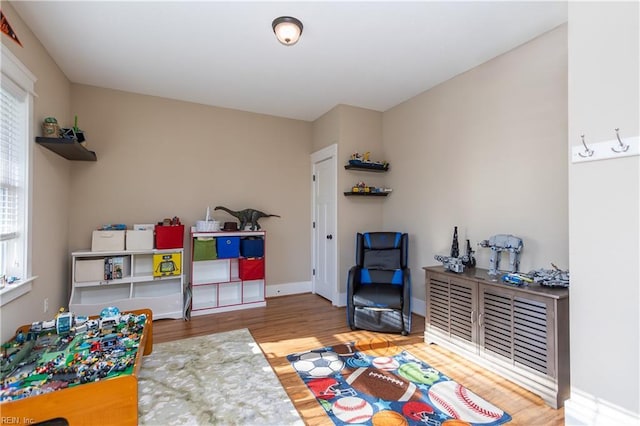 playroom featuring hardwood / wood-style flooring and a wealth of natural light