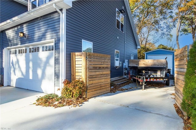 view of property exterior with a garage