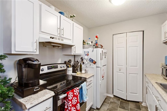 kitchen with white cabinets, a textured ceiling, white refrigerator, and stainless steel electric stove