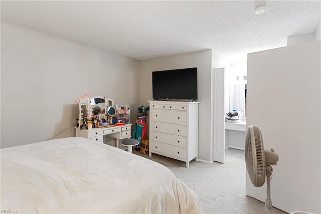 carpeted bedroom featuring a textured ceiling