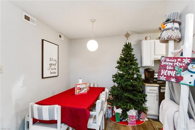 dining area featuring hardwood / wood-style floors