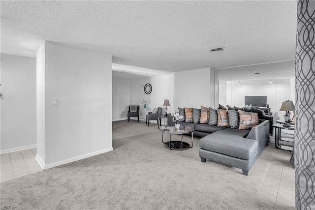 carpeted living room with a textured ceiling