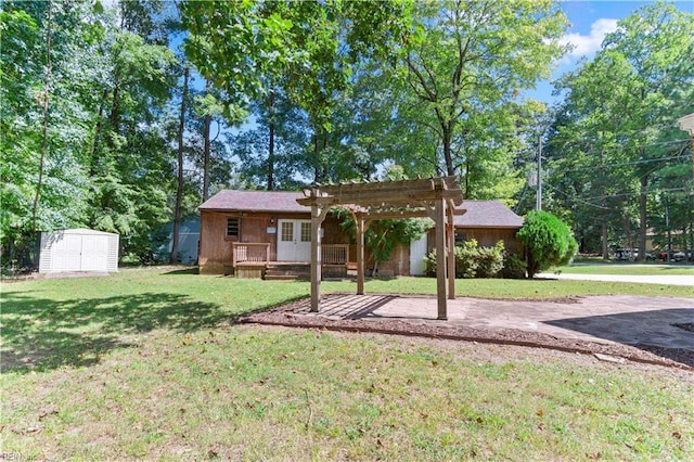 exterior space featuring a pergola, a yard, and a storage shed