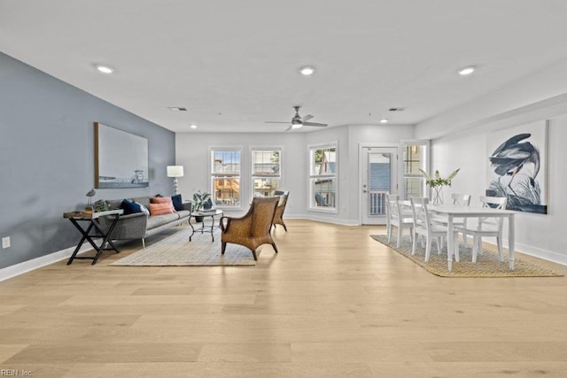 interior space with ceiling fan and light hardwood / wood-style flooring