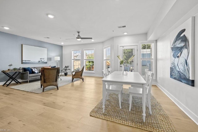 dining room featuring light hardwood / wood-style flooring and ceiling fan