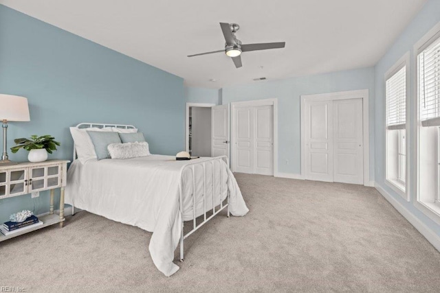 carpeted bedroom with ceiling fan