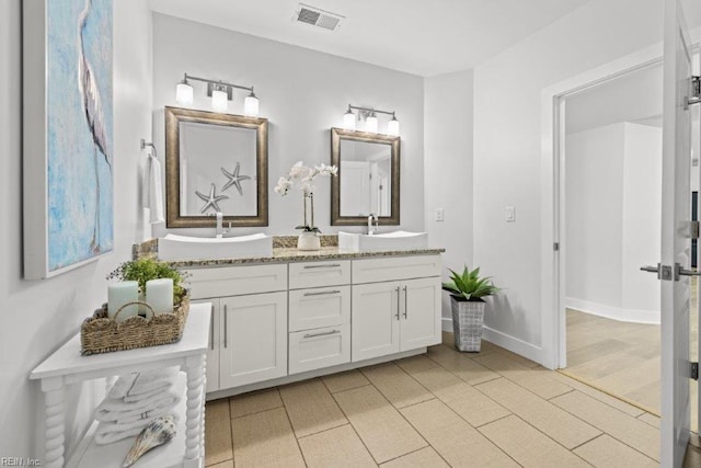 bathroom featuring hardwood / wood-style floors and vanity