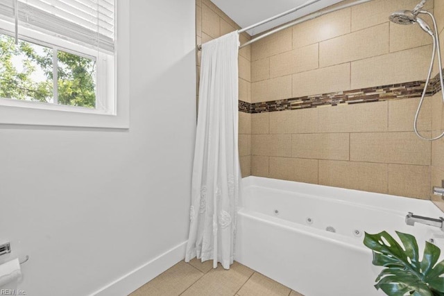 bathroom featuring tile patterned flooring and shower / bath combo with shower curtain