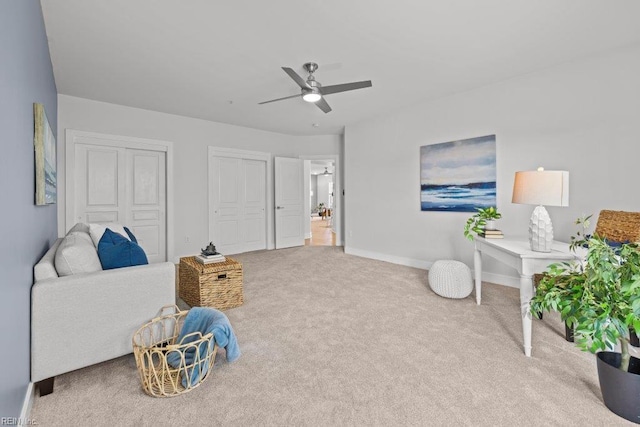 sitting room featuring carpet flooring and ceiling fan