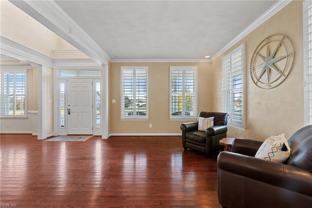 entryway with ornamental molding and dark wood-type flooring