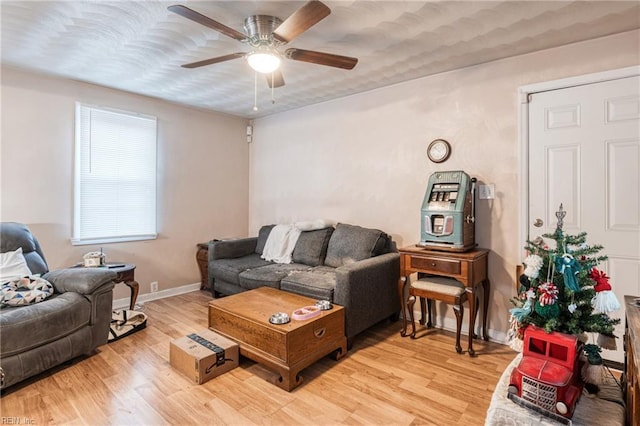 living room with hardwood / wood-style flooring and ceiling fan