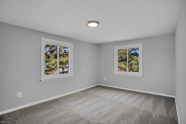 empty room with carpet flooring