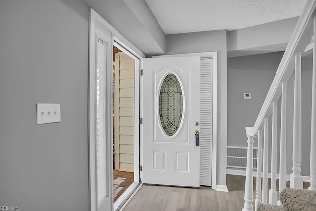 entrance foyer with light hardwood / wood-style floors