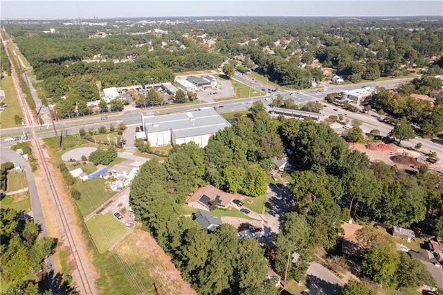 birds eye view of property with a forest view