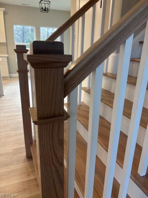 stairs with wood finished floors