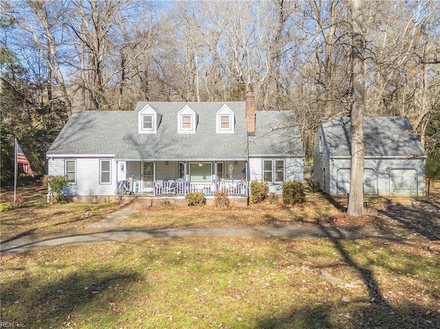 cape cod-style house with covered porch