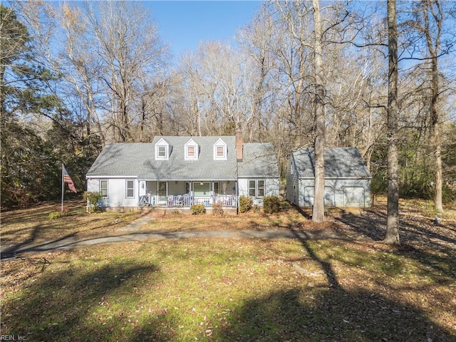 cape cod home with a front lawn and a porch