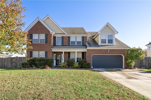 view of front of home with a garage and a front lawn