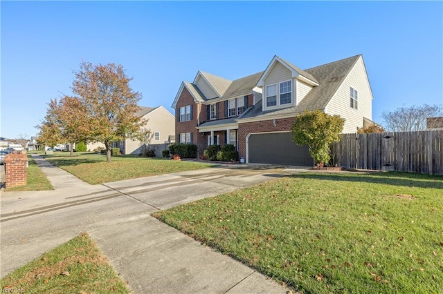 view of front of house featuring a garage and a front lawn